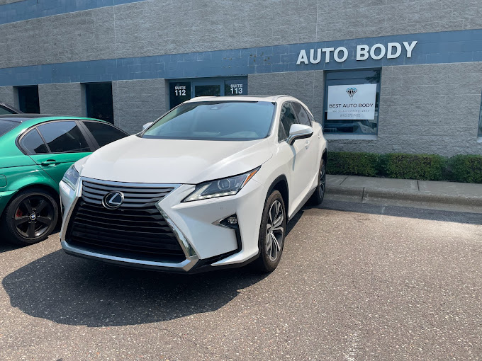 A freshly repaired and fixed white Lexus, showcasing a pristine appearance after maintenance or repairs, highlighting the attention to detail in the restoration process.