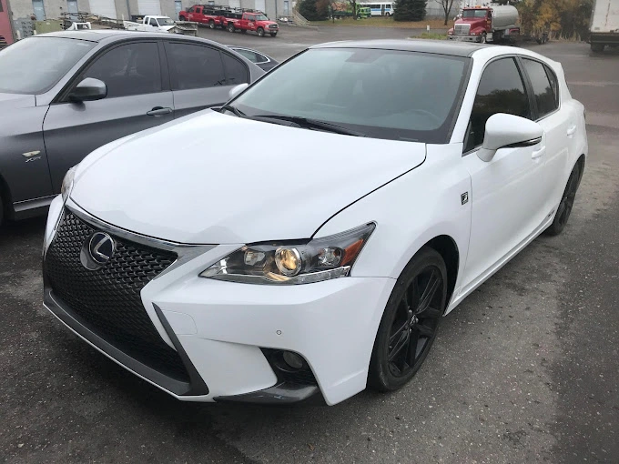 A freshly repaired and fixed white Lexus, showcasing a pristine appearance after maintenance or repairs, highlighting the attention to detail in the restoration process.