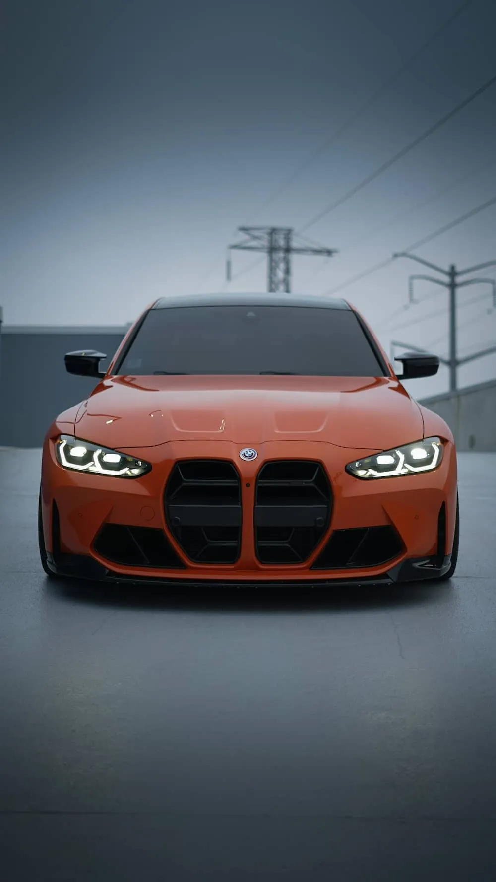 Front view of an orange BMW car.
