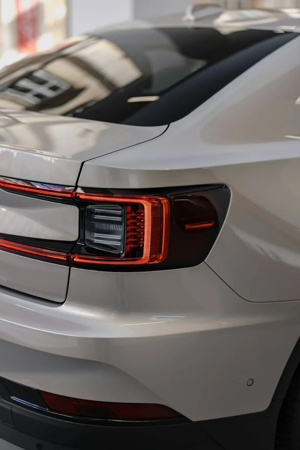 Rear view of a grey car.
